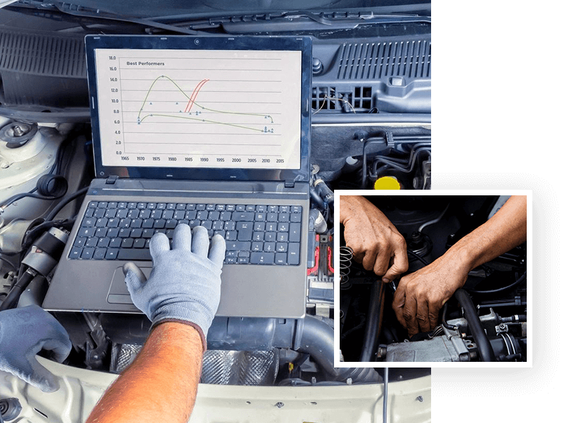 A person working on a laptop in front of an engine.