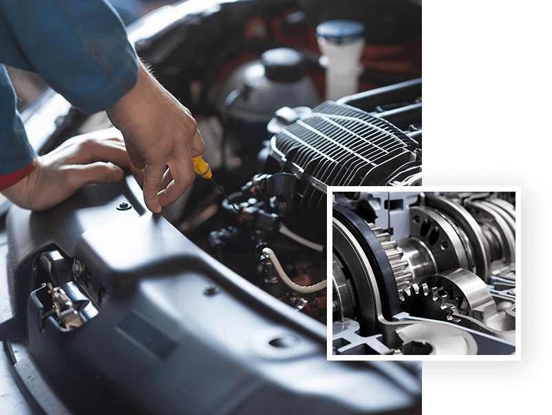 A person working on an engine in a car.